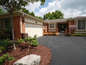 Houses with curb appeal have eye-catching gardens and features, such as outside wood decor and stone work, London realtor Lynne Mallette says. (Special to the Free Press)