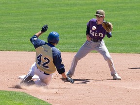 St. Clair Secondary School player Brett Bridges keeps his eye on an incoming ball as Notre Dame Catholic Secondary School player Jonathan Thibodeau slides safely into second base during their OFSAA baseball west regional game at Labatt Memorial Park in London, Ontario on Thursday June 5, 2014.

CRAIG GLOVER/The London Free Press/QMI Agency