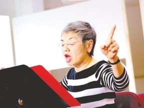 Judy Brown, retired music educator and Western Don Wright music faculty grad, directs the Cantorion Choir. (Special to QMI Agency)
