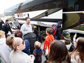 North Bay Battalion fans greet assistant coach John Goodwin as he boards the bus on May 8 for the team's road trip to Guelph for Game 5 of the OHL championship series. (Jordan Ercit/QMI Agency)