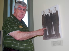 North America Railway Hall of Fame office administrator George Riman points to a display featuring past inductees the Cosens Brothers at the hall of fame in St. Thomas. The hall welcomes 15 new inductees at a ceremony Friday in St. Thomas. Ben Forrest/Times-Journal