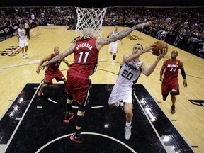 Spurs guard Manu Ginobili drives to the basket during Thursday night's game against the Miami Heat. (USA TODAY SPORTS)