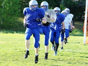 Gino Donato/The Sudbury Star
Sudbury Junior Gladiators' Graham Stevens leads the team through warmup on Thursday prior to practice at Lockerby Field.