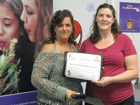 CONTRIBUTED PHOTO
Heather Brekelmans, right, Big Brothers Big Sisters of Ingersoll, Tillsonburg and Area resource development coordinator, presents the 2014 Bowl For Kids Sake Top Business Team fundraising award to Michelle Eisen of Ingersoll Home Building Centre, which raised $3,115.