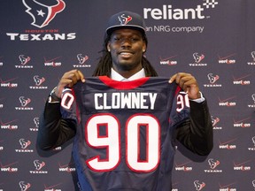 Jadeveon Clowney displays his Houston Texans jersey as he is introduced at Reliant Stadium on May 9, 2014 in Houston, Texas.  (Bob Levey/Getty Images/AFP)