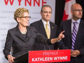 Premier Kathleen Wynne and Deputy Mayor Norm Kelly (middle) and during a presser after they both spoke at the Canadian Club of Toronto at the Metro Toronto Convention Centre in Toronto, Ont. on Thursday June 5, 2014. Kelly gave his endorsement to Wynne. (QMI Agency)