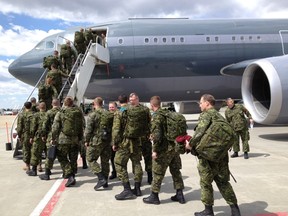 Troops board a CC-150 Polaris jet to Latvia on Fri., June 6, 2014, to take part in U.S. Europe-led security exercise. PERRY MAH/EDMONTON SUN