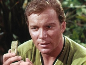 Captain James T. Kirk holds a communicator, which served as the inspiration for the flip phone. (SCREENSHOT)