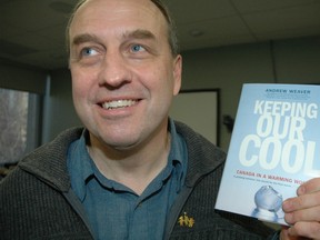 Anti-oilsands activist Andrew Weaver holding up his book "Keeping our Cool". (QMI Agency)