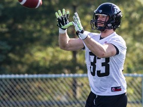 Former Queen's receiver Scott Macdonell catches a pass during the first day of the Ottawa RedBlacks training camp on June 1. (Errol McGihon/QMI Agency)