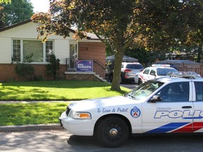 A house on Shoreview Dr., in the city's east end, remains under guard by Toronto Police after a double drowning in a pool Friday evening. Two cruisers were parked out front Saturday and officers kept watch over the scene in the home's backyard. (Chris Doucette/Toronto Sun)