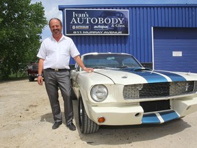 Ivan Pecuh, of Ivan's autobody, poses with one of the many cars he has painted beautifully over his more than 30 years in the business.  Tuesday, June 4, 2014.  (Chris Procaylo/Winnipeg Sun)