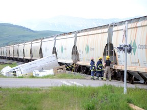 A driver suffered minor injuries and a horse is dead after a train collided with a truck and trailer in Lundbreck on the evening of Saturday, June 7, 2014. John Stoesser photo/QMI Agency.