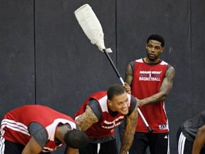 Miami Heat forward Udonis Haslem (right) jokes around with forward Michael Beasley during practice in San Antonio yesterday. (Reuters)