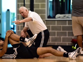 San Antonio Spurs head coach Gregg Popovich talks to forward Tim Duncan during practice in San Antonio yesterday. (USA TODAY)