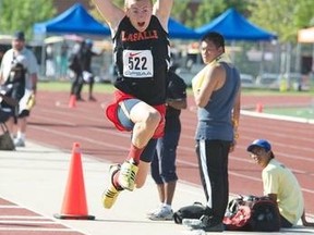 Lasalle Secondary School's Ryan Taylor in mid-flight during his gold-medal winning leap during OFSAA triple jump on Friday.