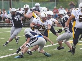 Sault Steelers running back shakes a Sudbury Spartans defender during NFC action at James Jerome Sports Complex on Saturday night. Gauthier scored a league-record eight rushinig touchdowns in a 65-6 Steelers win.