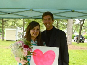 The mystery of the pink heart signs in Welland was solved Sunday when Ryan St. Denis proposed to girlfriend and Tribune reporter Maryanne Firth at Chippawa Park. (Supplied Photo)