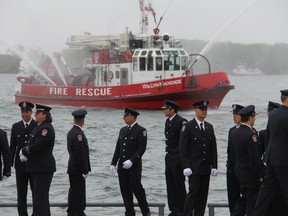 Firefighters at the annual Memorial Honour Roll service at Harbourfront Fire Station Sunday, June 8, 2014. (Angela Hennessy/Toronto Sun)