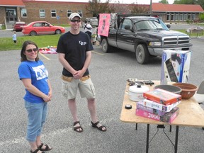 Relay for Life team coordinator Kerri Holder and co-chair Darell Plummer promote the 2014 event in support of the Canadian Cancer Society at the Trunk Sale fundraiser held in the Confederation College parking lot, Saturday, June 7.