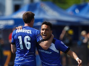 Edmonton forward Daryl Fordyce (16) and forward Sadi Jalali (9) celebrate Fordyce's second half goal against Carolina during an NASL soccer game between FC Edmonton and the Carolina RailHawks at Clarke Stadium in Edmonton, Alta., Sunday June 8, 2014. Final score was 6-1 for the Eddies. Ian Kucerak/Edmonton Sun/QMI Agency