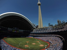The Beezer applauds every ticket-holder (42,981 brave souls) in this photo who made it down to Saturday’s game at the Rogers Centre. The Beezer points out the city of Toronto has done its best to keep fans away from the baseball stadium by creating as much traffic chaos as possible. (Dan Hamilton/USA Today)