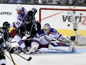Kings' Dwight King scores on New York Rangers goalie Henrik Lundqvist during Game 2 in Los Angeles on Saturday. (GETTY IMAGES)