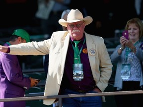Steve Coburn, co-owner of California Chrome waves to fans at Belmont Park on June 7, 2014 in Elmont, New York. (Mike Ehrmann/Getty Images/AFP)