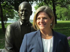 Ontario NDP Leader Andrea Horwath, standing in front of a Jack Layton statue at the Toronto ferry terminal Monday, said he fought Liberal corruption his whole career. (ANTONELLA ARTUSO/Toronto Sun)