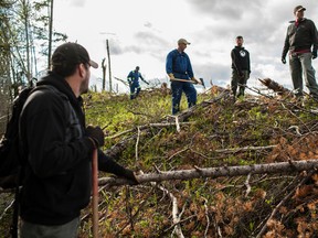 From left: Mike Penner, Michael Benko, Patrick Benko, Matt Ogrodnick and Darrell Strebchuk survey the hillside behind the Forest Interpretive Centre before they start work on the mountain bike trail. 
Christopher King |  Whitecourt Star