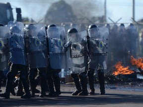 Brazilian soldiers face demonstrators during an anti-hooligan exercise in Brasilia May 3, 2013. (REUTERS/Fabio Pozzebom)