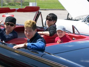 Students from the Nippon campus in Blairmore pile in to a 1962 T-Bird at the Pincher Creek Show and Shine. Greg Cowan photo/QMI Agency.