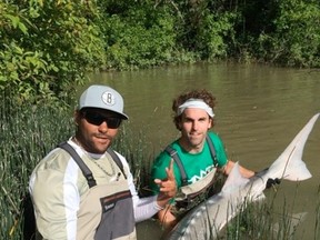 Dustin Byfuglien (left) and Andrew Ladd fishing in happier times. (TWITTER PHOTO)