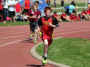 Connor Nesbitt of St. Phillip's Petrolia enters the back stretch during the intermediate boys 1500m run at the St. Clair Catholic District School Board elementary track and field meet on Saturday, June 7. Nesbitt won the race with a time of 5:47.41. SHAUN BISSON/THE OBSERVER/QMI AGENCYConnor Nesbitt of St. Phillip's Petrolia enters the back stretch during the intermediate boys 1500m run at the St. Clair Catholic District School Board elementary track and field meet on Saturday, June 7. Nesbitt won the race with a time of 5:47.41. (SHAUN BISSON, The Observer)