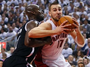 Toronto Raptors centre Jonas Valanciunas (17) drives to the net against Brooklyn Nets defender Kevin Garnett during Game 2 of the first-round NBA playoff series at the Air Canada Centre.  (John E. Sokolowski/USA TODAY Sports)