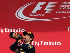 Red Bull Formula One driver Daniel Ricciardo of Australia drinks champagne after winning the Canadian Grand Prix at the Circuit Gilles Villeneuve in Montreal on Sunday. (Chris Wattie/Reuters)