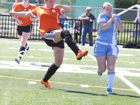 Lasalle Lancers' Keighley Steinke-Gauthier kicks the ball past Marina Plexman of the St. Benedict Bears during senior girls division 2 championship soccer action from James Jerome Field on Monday afternoon.
