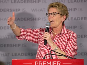 Premier Kathleen Wynne speaks to supports during a rally at the campaign office of Nick Steinburg in London, Ontario on Monday, June 9, 2014. (DEREK RUTTAN, The London Free Press)