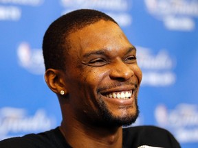 The Miami Heat's Chris Bosh speaks to the media at a pregame press conference. (Mike Stone/Reuters)