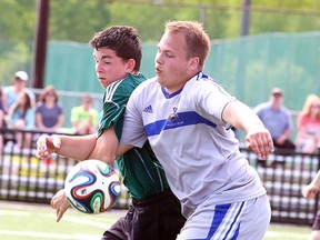 Espanola Spartans Riley Nadeau and  Nicholas Lamothe of Sacre Couer fight for the ball during senior boys division 2 championship soccer action from James Jerome Field on Monday afternoon.
