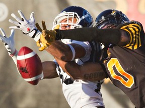 Argos and Ticats do battle in a game last season. (Reuters/Files)