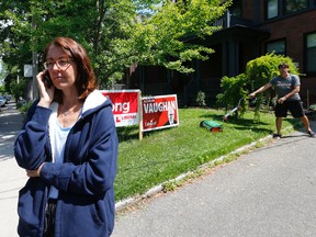 Roberta Scott, the Ontario PC candidate for the riding of Trinity-Spadina in downtown Toronto, Monday June 9, 2014. She happens to be standing in front of the house of Dr. Eric Hoskins, a Liberal candidate from another riding, who was cutting his lawn. (Michael Peake/Toronto Sun)