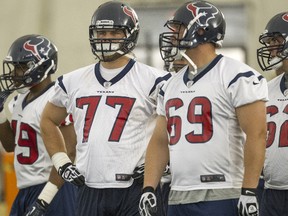 Tackles David Quessenberry #77 and Nick Mondek #69 of the Houston Texans Houston Texans rookie mini camp on May 10, 2013 in Houston, Texas. (Bob Levey/Getty Images/AFP)