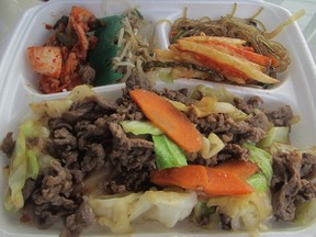 Mama Lee’s beef bulgogi combo – kim chi, bean sprout salad, yam fries and glass noodles across the back, beef, carrots and cabbage on rice across the front.