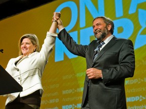 Federal NDP Leader Thomas Mulcair and Ontario NDP Leader Andrea Horwath are pictured in Hamilton, Ont., in this April 15, 2012 file photo. (Ernest Doroszuk/QMI Agency)
