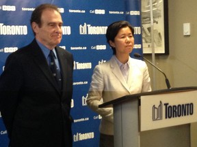 Deputy Mayor Norm Kelly and Councillor Kristyn Wong-Tam give an update on Toronto's Grand Pride Wedding on Tuesday. (DON PEAT/Toronto Sun)