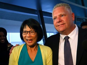 Mayoral candidate Olivia Chow has her statement to the media crashed by Councillor Doug Ford at City Hall on Tuesday, June 10, 2014. (DAVE ABEL/Toronto Sun)