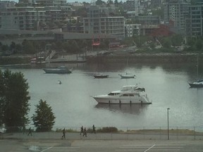 Vancouver police respond to a shooting near Science World in the city's downtown Tuesday.

QMI Agency