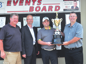 (L-R): Owner of CHB Developments and co-owner of Royal LePage Portage Realty Chris Bures, Portage Golf Club president Preston Meier, Portage Golf Club head pro Brad Young, and co-owner of Royal LePage Portage Realty Warren Neufeld pose with the Portage Men's Open trophy June 9. The tournament will now be sponsored by Royal LePage. (Kevin Hirschfield/THE GRAPHIC)