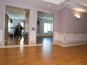 Visitors take a tour during the grand opening of St. Joseph's Auxiliary Hospital's newly renovated palliative care hospice.

Ian Kucerak/QMI Agency